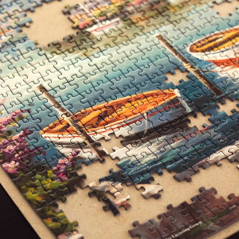 Unfinished jigsaw puzzle on table
